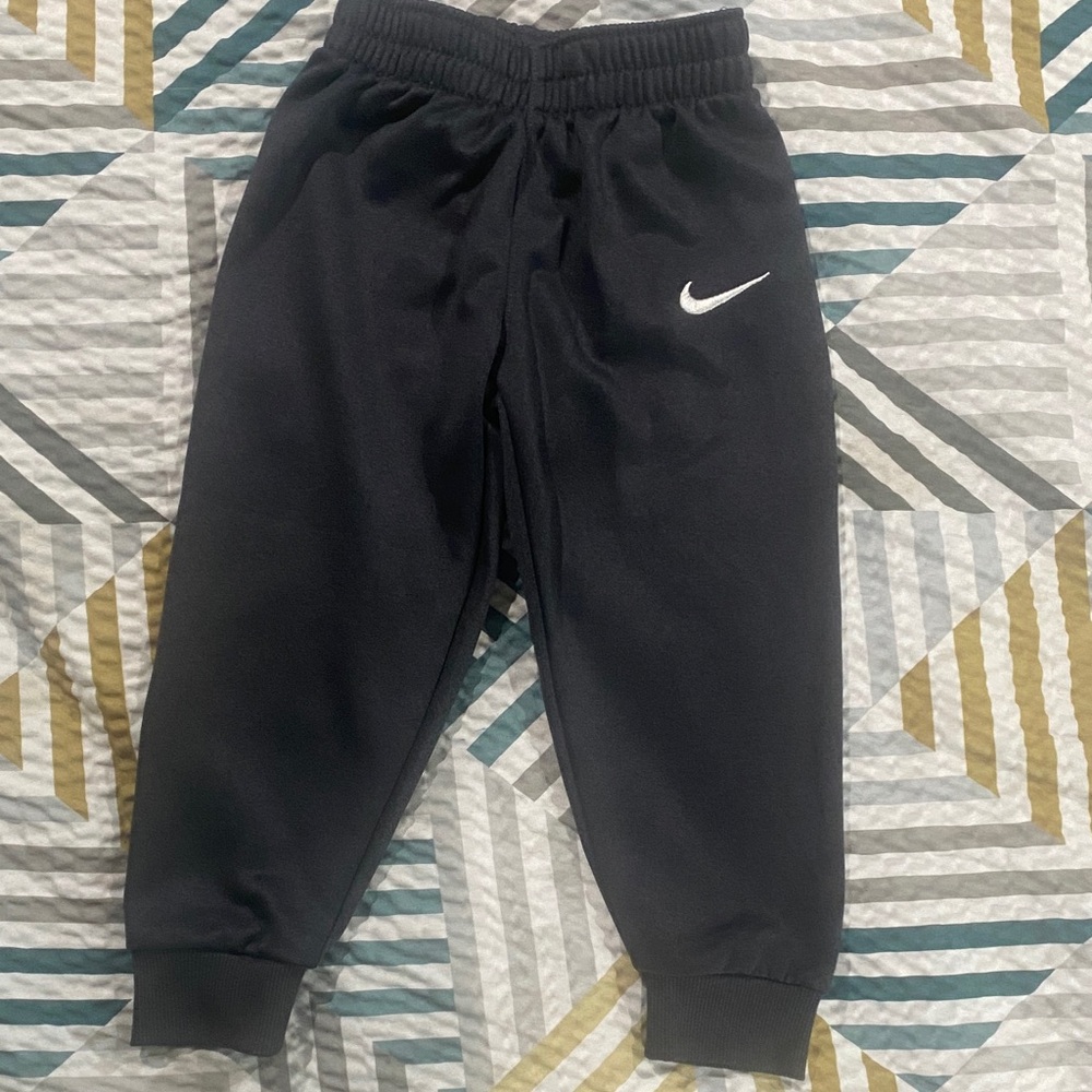 Nike Kids charcoal Sweatpants with silver Logo